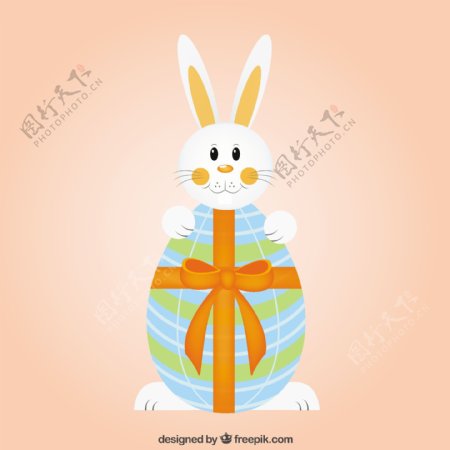 可爱的兔子和复活节的鸡蛋与带