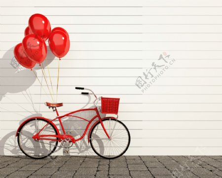 吊着气球的红色自行车图片