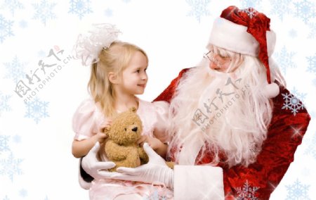 圣诞老人抱着可爱漂亮小女孩图片