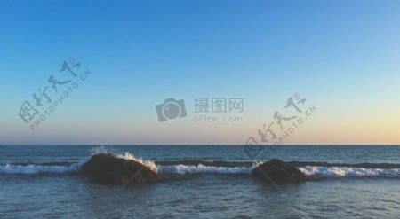 大海夕阳沙滩海洋岩石波浪海滨