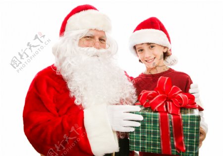 拿着礼物的圣诞老人与小男孩图片